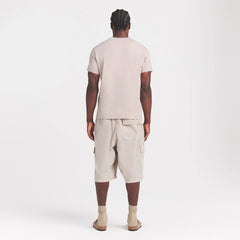 SKIMS COTTON MENS CLASSIC T-SHIRT | STONE ON A MODEL FRONT VIEW @ | FOCUS: 0.0, 1.0, 0.9