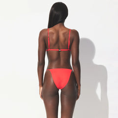 ICONIC SWIM TRIANGLE BIKINI TOP | CARMINE ON A MODEL SIDE VIEW