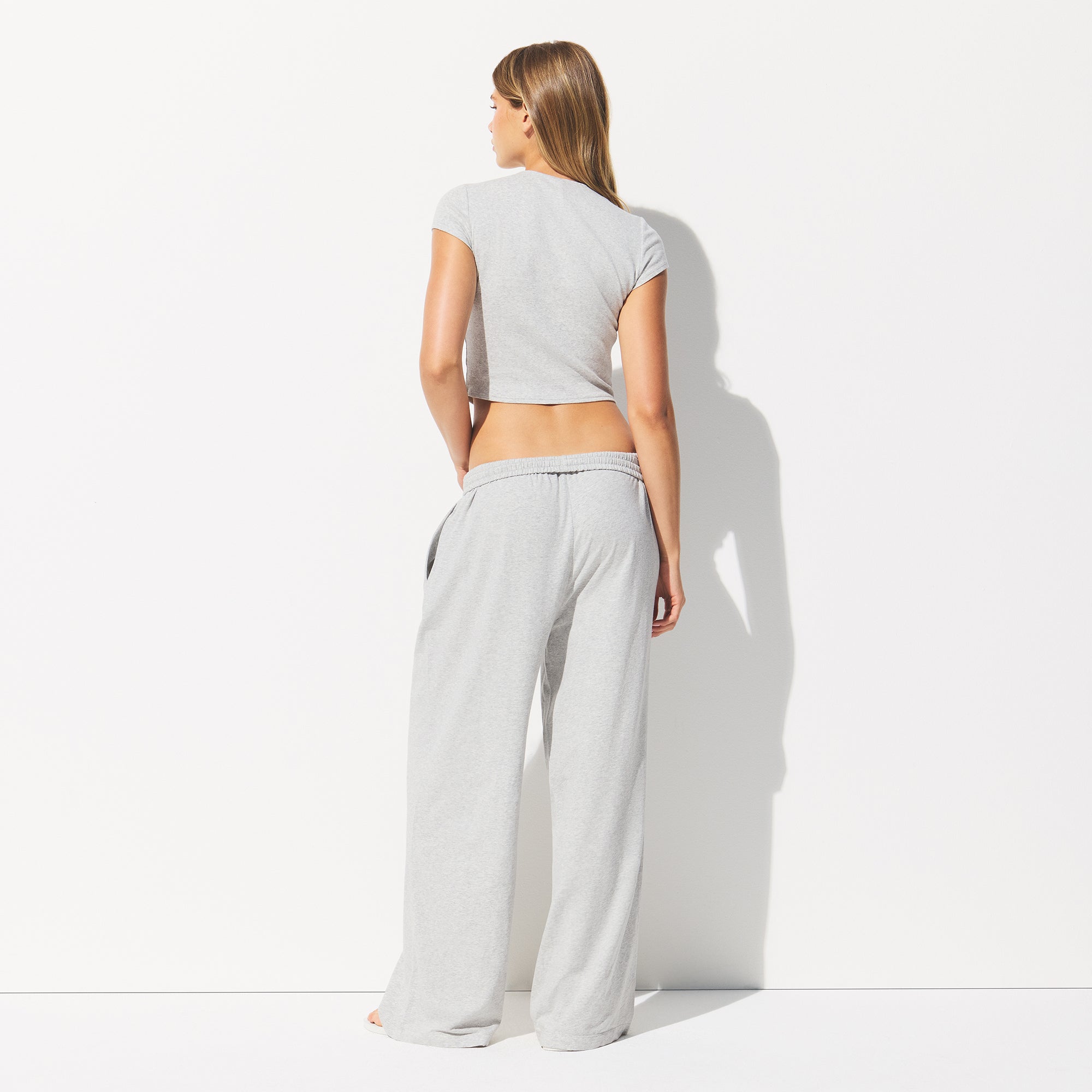 COTTON JERSEY WIDE LEG PANT | LIGHT HEATHER GREY ON A MODEL BACK VIEW @ | FOCUS: 0.0, 1.0, 0.9