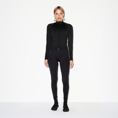 NikeSKIMS MATTE MOCK NECK FULL ZIP JACKET | OBSIDIAN ON A MODEL FRONT VIEW @ | FOCUS: 0.0, 1.0, 0.9