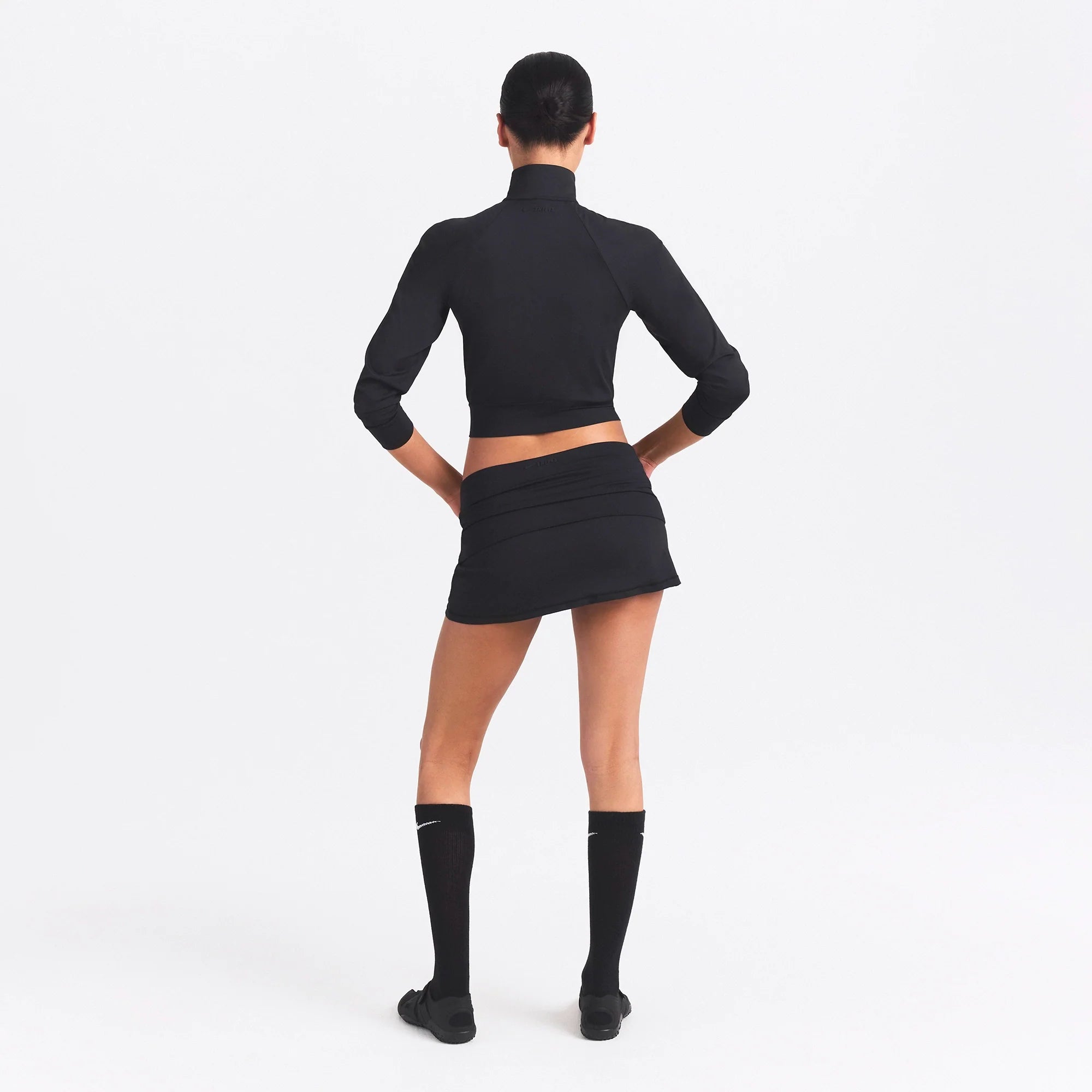 NikeSKIMS AIRY TRACK JACKET | OBSIDIAN ON A MODEL SIDE VIEW @ | FOCUS: 0.0, 1.0, 0.9